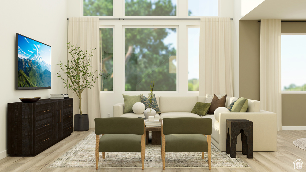 Sitting room featuring baseboards and wood finished floors