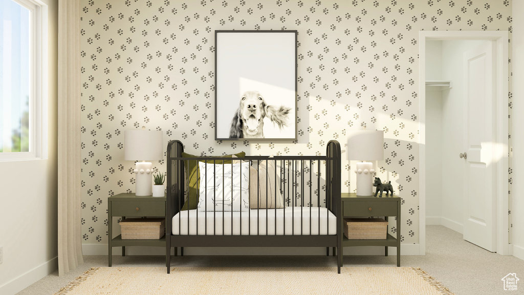 Carpeted bedroom featuring baseboards and wallpapered walls