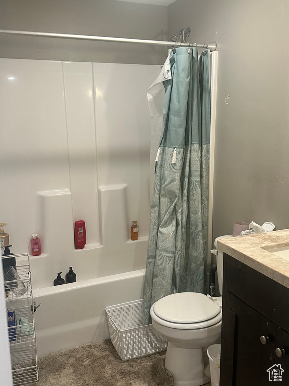 Full bath with toilet, vanity, and shower / bathtub combination with curtain