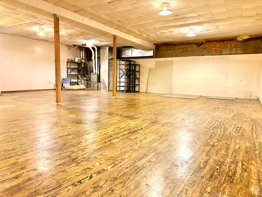 Finished basement featuring hardwood / wood-style floors