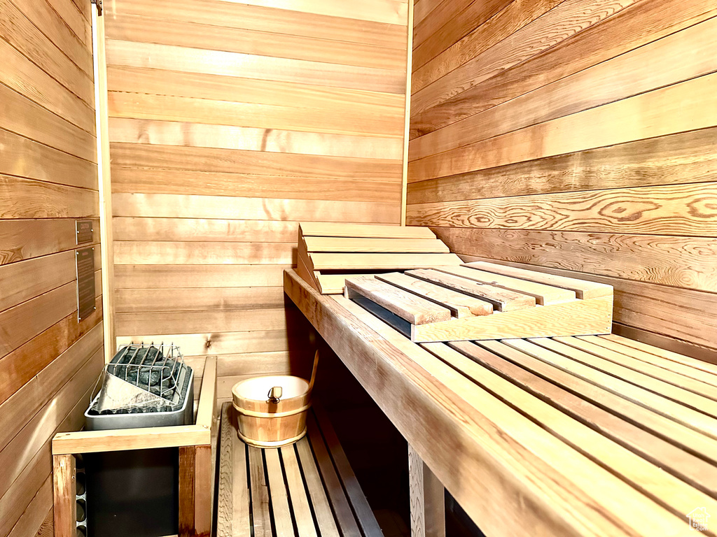 Sauna / steam room featuring wooden walls