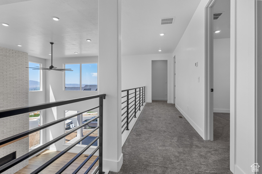Corridor with carpet, recessed lighting, and baseboards