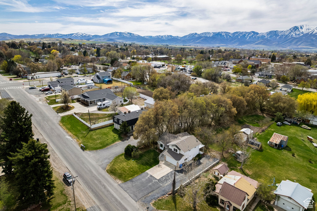 Birds eye view of property with a mountain view and a residential view