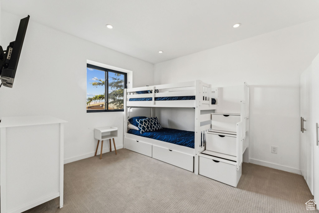 Bedroom with carpet floors, baseboards, and recessed lighting