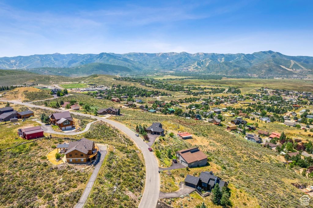 Birds eye view of property with a mountain view
