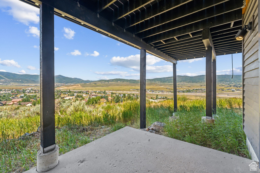 View of patio with a rural view and a mountain view