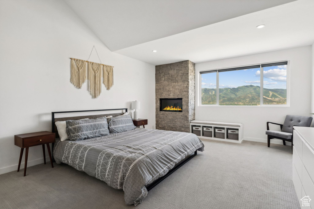 Bedroom with recessed lighting, baseboards, a large fireplace, and carpet floors