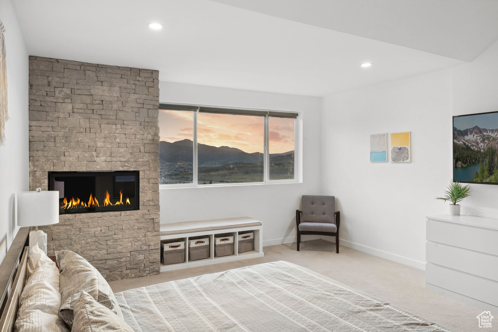 Carpeted bedroom with recessed lighting, a fireplace, and baseboards