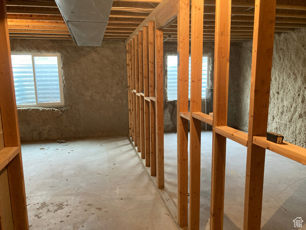 Misc room featuring unfinished concrete floors