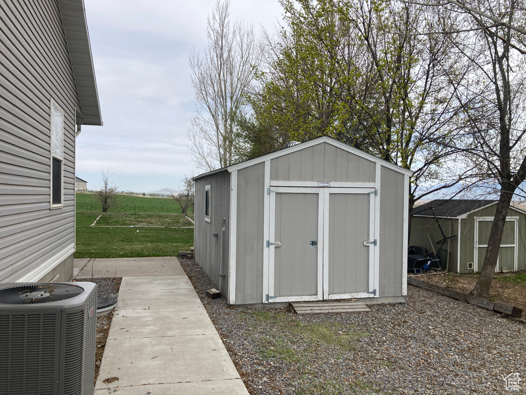 View of shed with central air condition unit