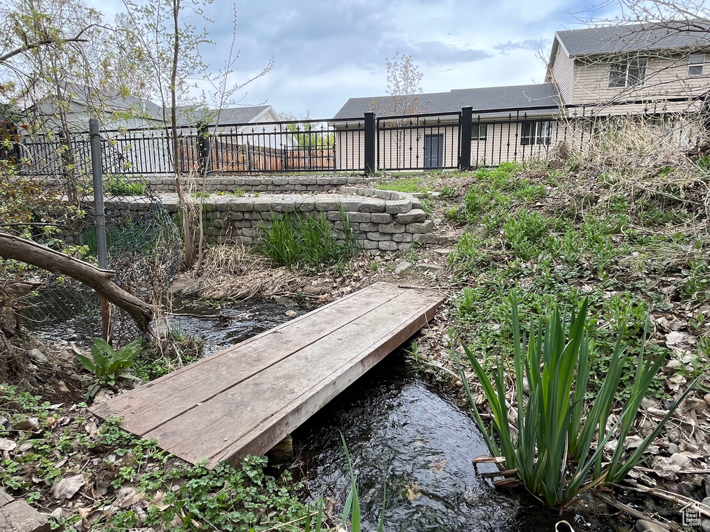 View of yard featuring fence