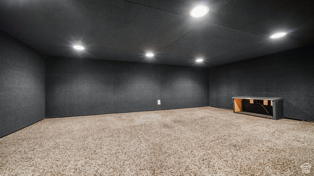 Carpeted spare room featuring recessed lighting