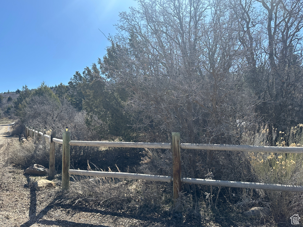 View of gate featuring fence
