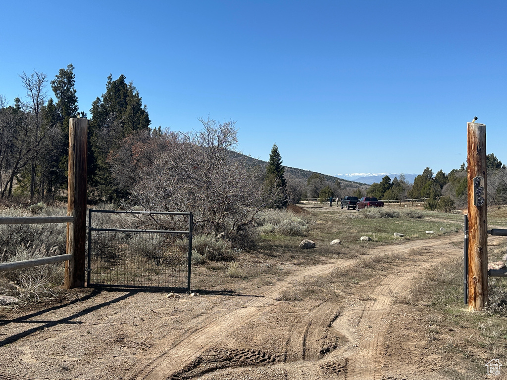 Exterior space with a gated entry, a gate, and a rural view