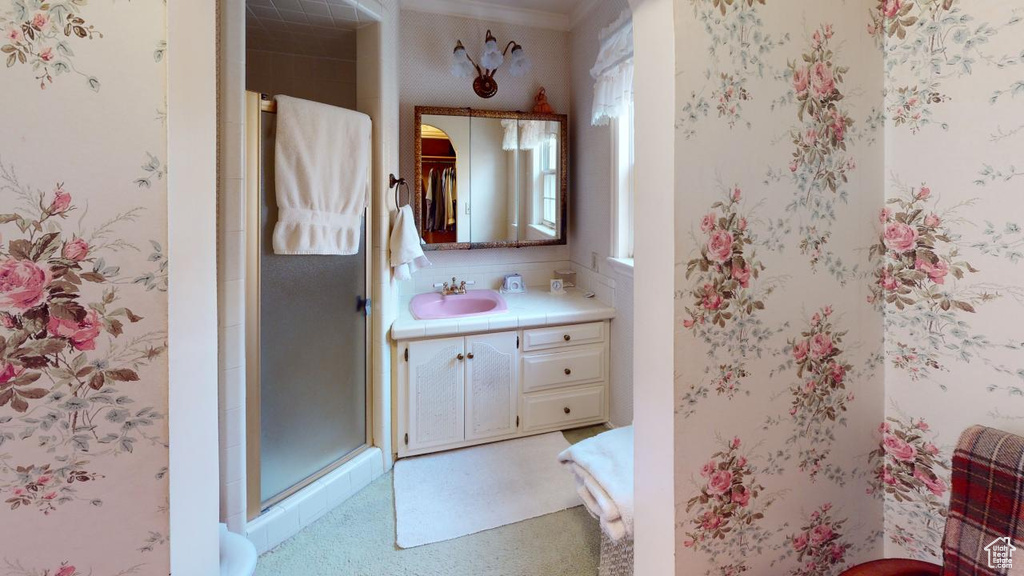 Full bath featuring vanity and a stall shower