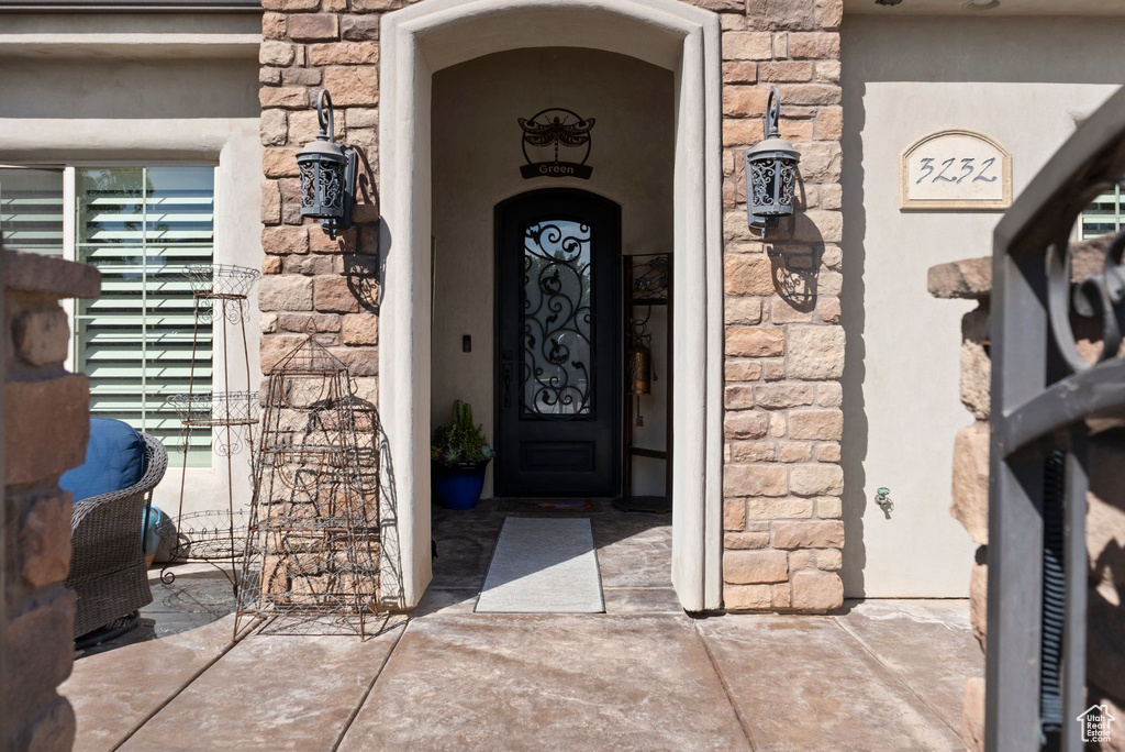 Property entrance with stone siding
