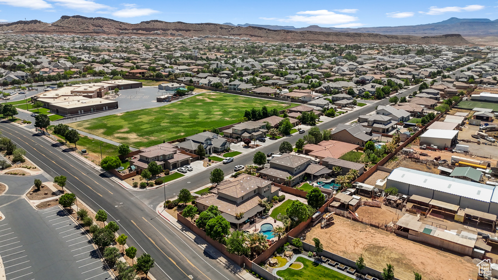 Aerial view of residential area featuring a mountain backdrop