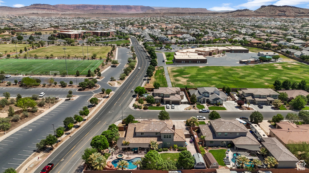 Aerial view of residential area featuring a mountainous background
