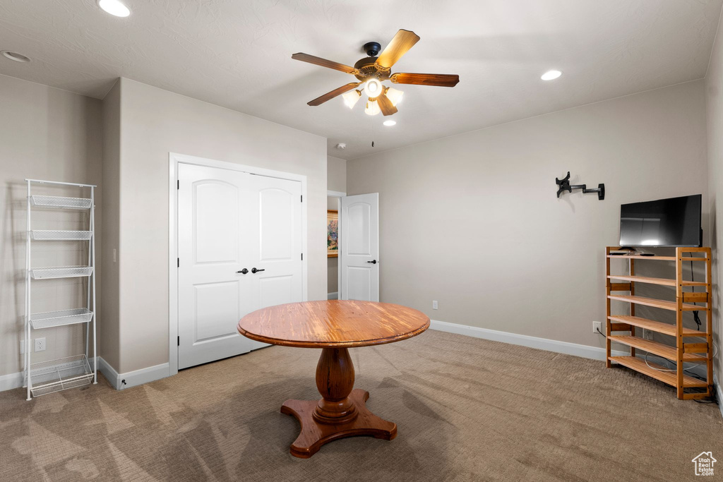 Interior space with carpet floors, baseboards, recessed lighting, and a ceiling fan