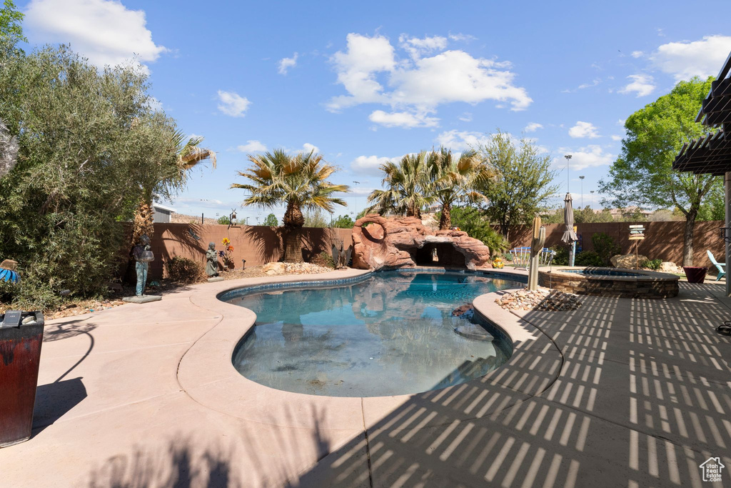 View of pool with a patio area, a fenced backyard, and a fenced in pool