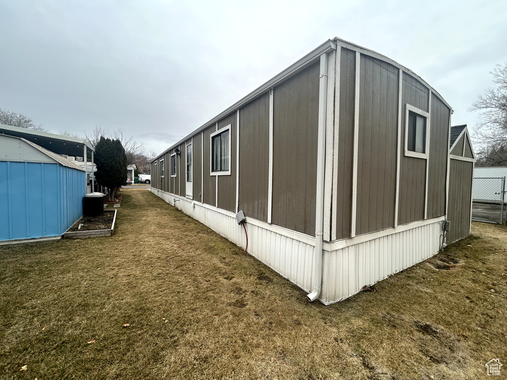 View of home's exterior featuring a lawn