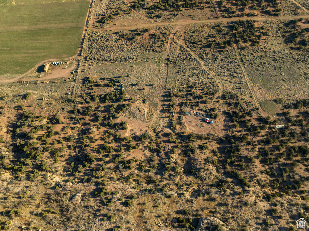 Birds eye view of property with a rural view
