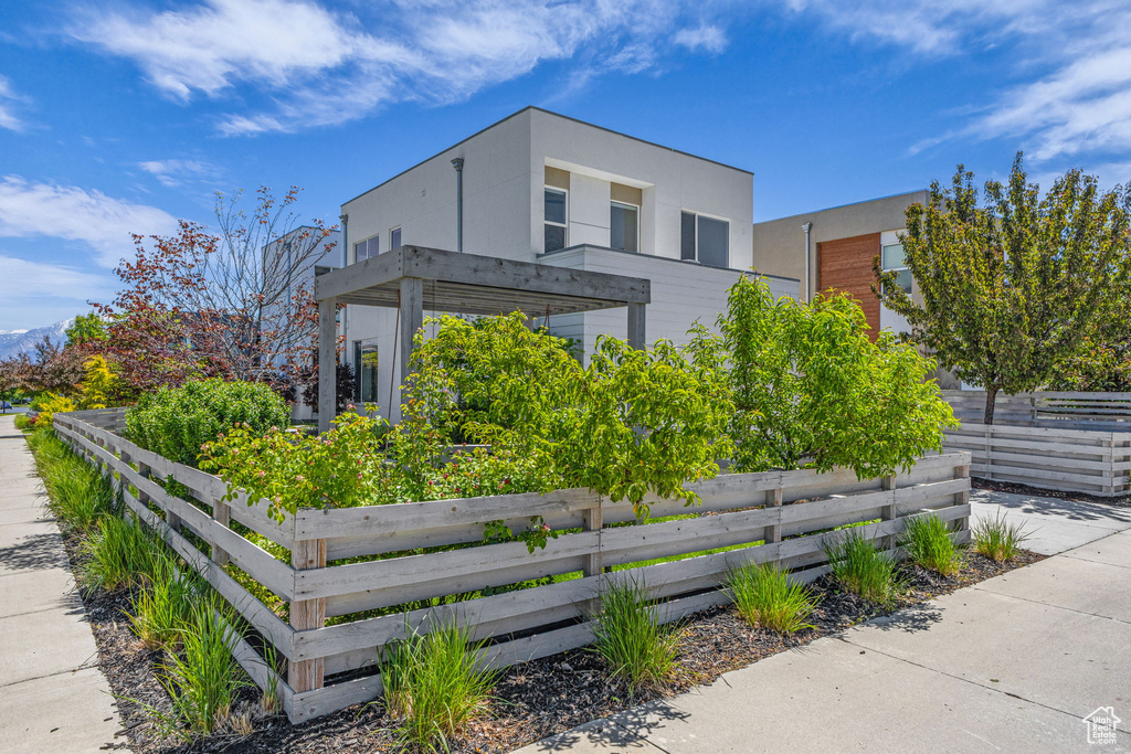 View of front of property featuring stucco siding