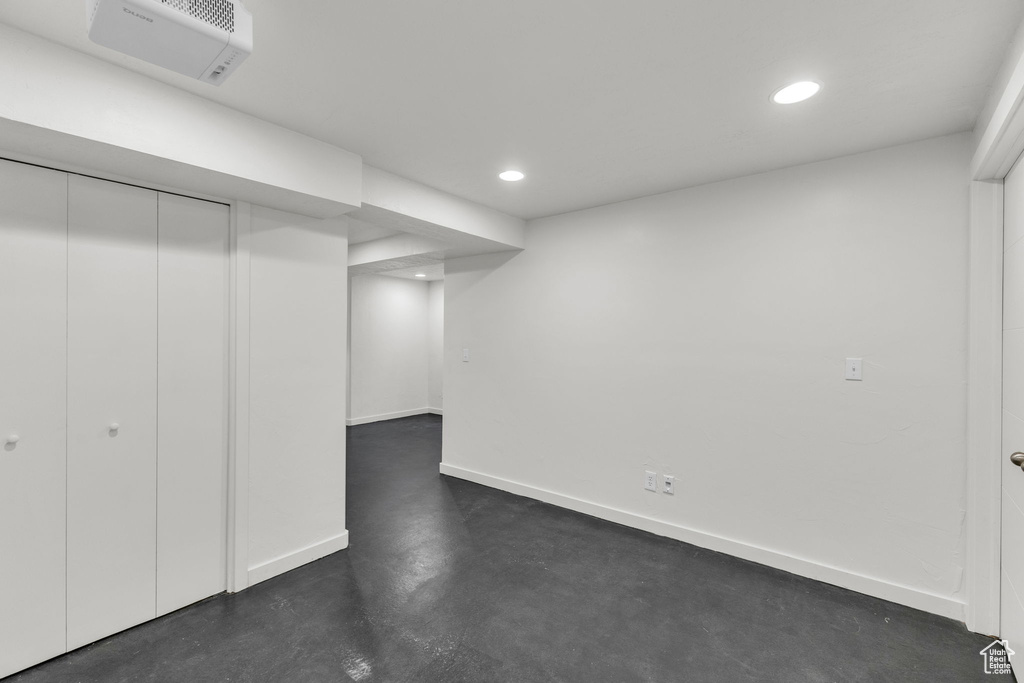 Finished below grade area featuring recessed lighting and baseboards