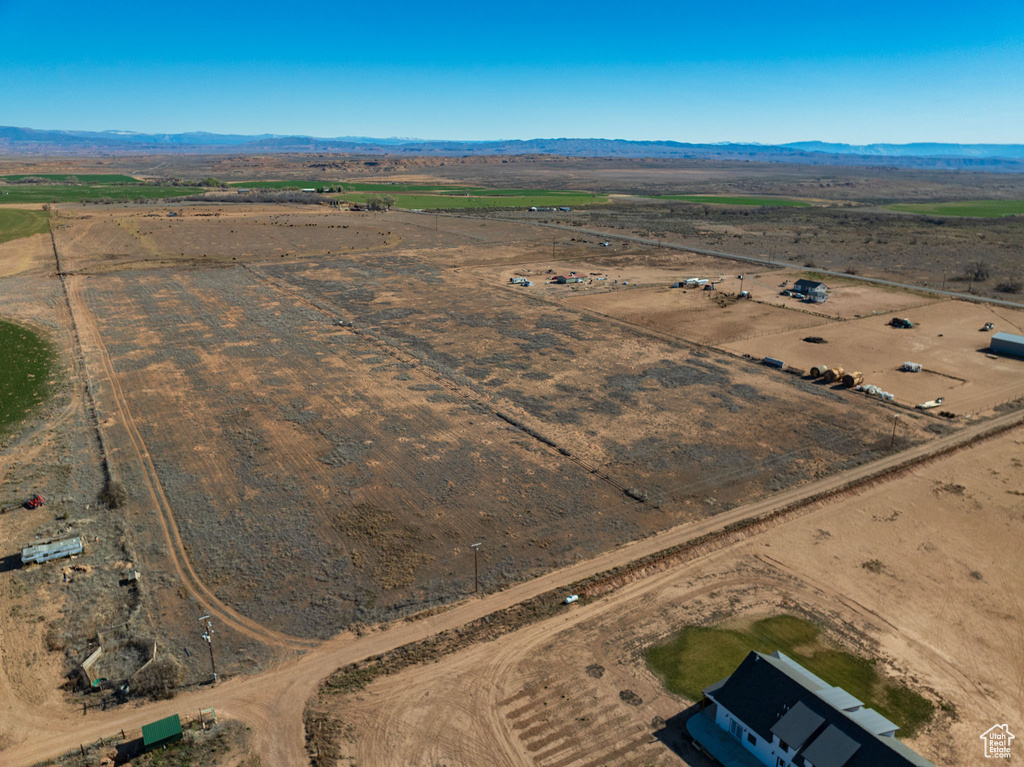 Birds eye view of property featuring a rural view and a mountain view