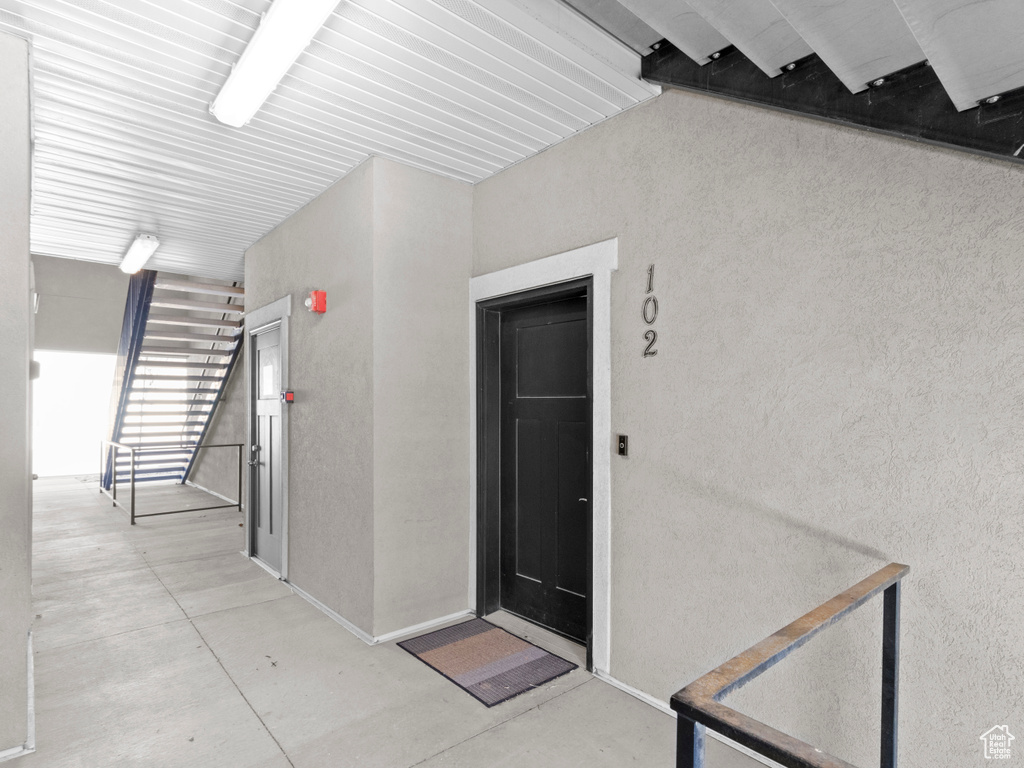 Property entrance with stucco siding