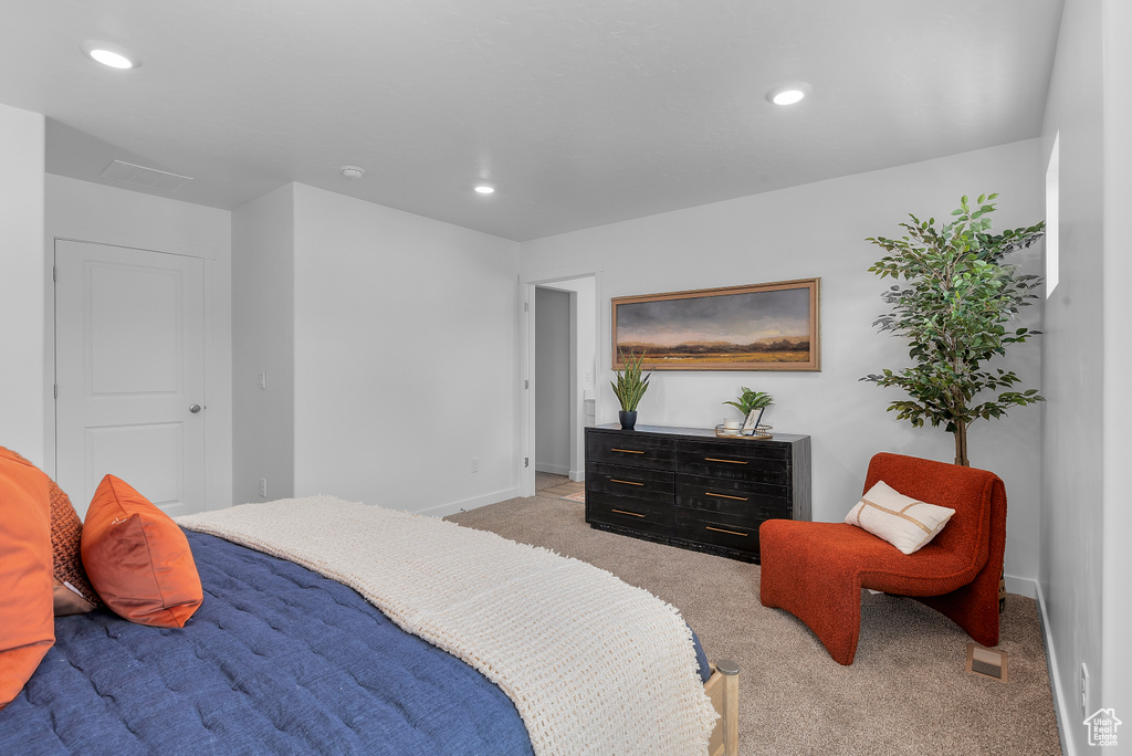 Bedroom featuring recessed lighting, light colored carpet, and baseboards