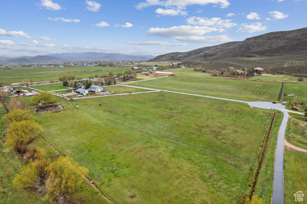 Birds eye view of property featuring a mountain view and a rural view
