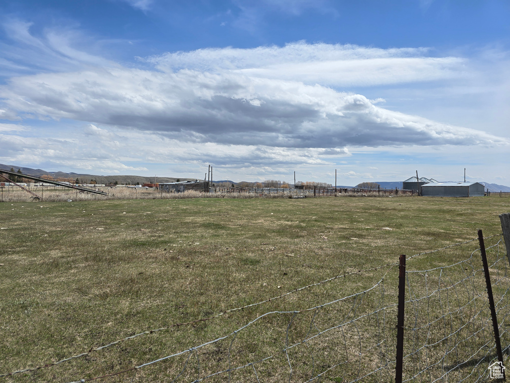 View of yard featuring fence