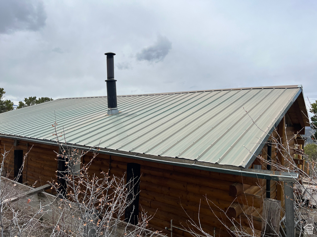Details with log siding and metal roof