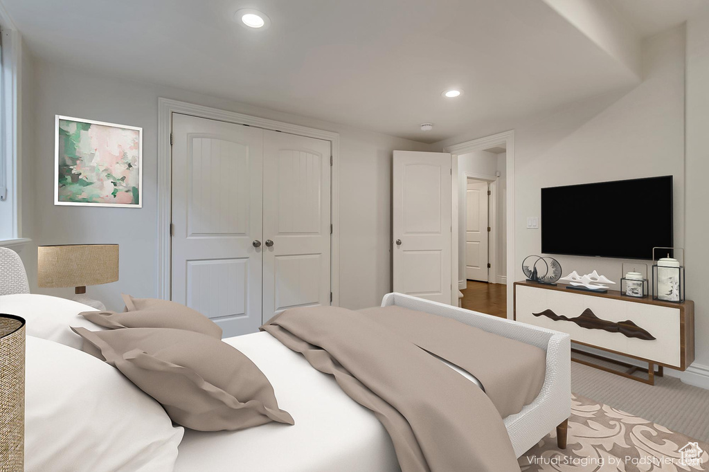 Bedroom with baseboards, a closet, and recessed lighting