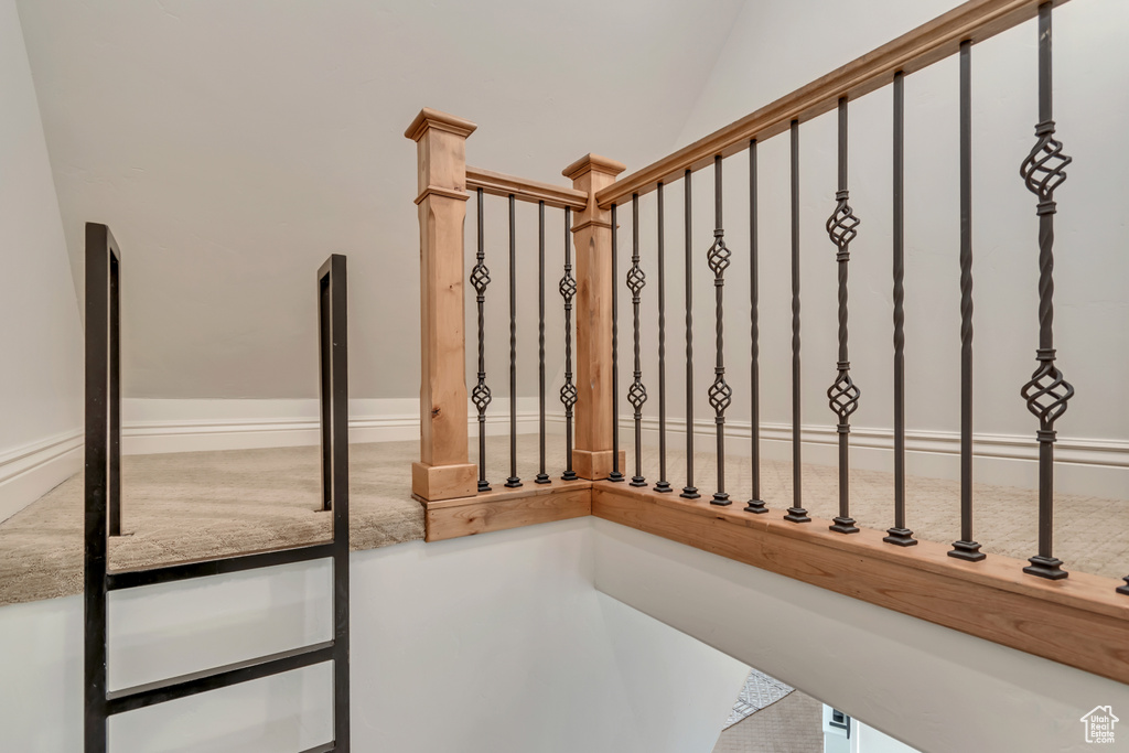 Staircase with lofted ceiling