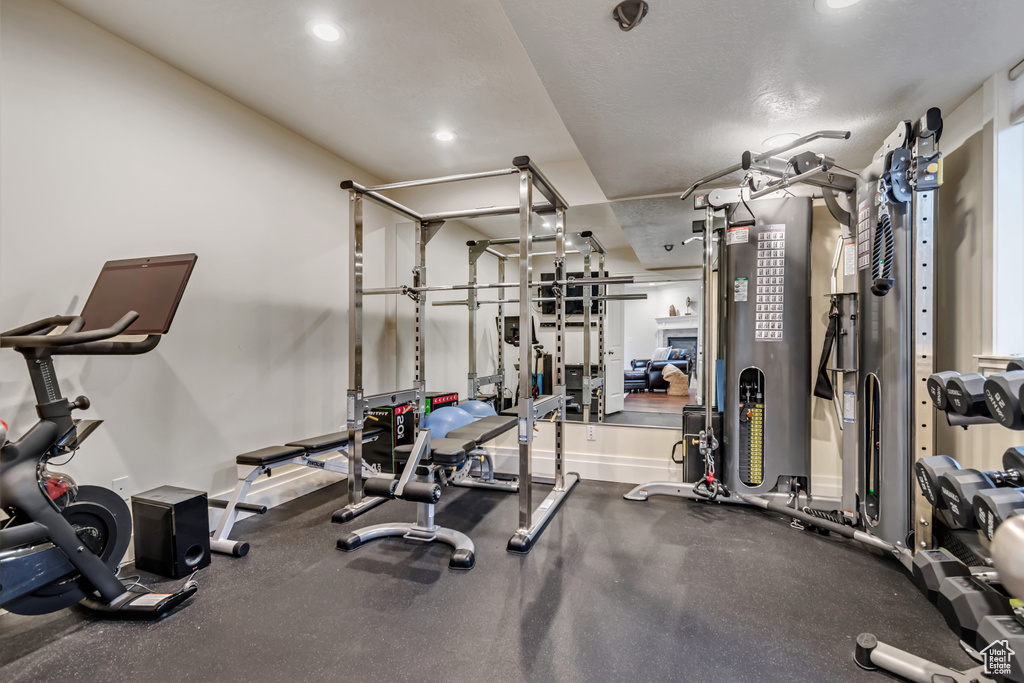 Workout area featuring recessed lighting and baseboards