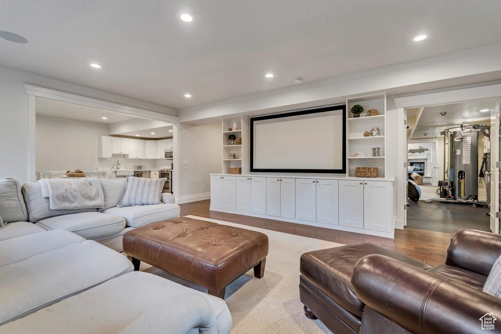 Living room featuring recessed lighting, light wood-type flooring, and baseboards