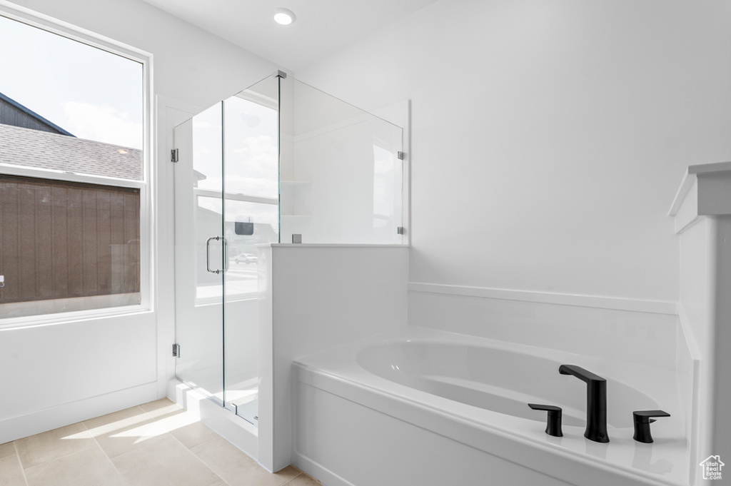 Full bathroom with a bath, a shower stall, tile patterned flooring, and recessed lighting