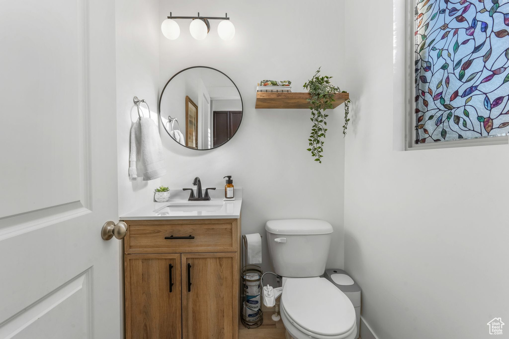 Bathroom with toilet and vanity