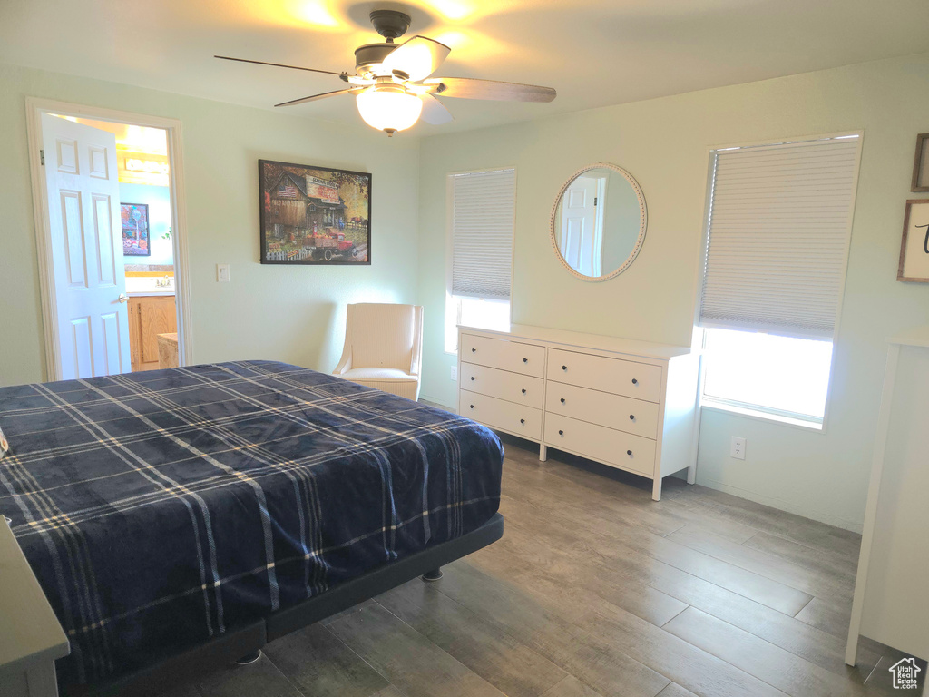 Bedroom with wood finished floors and a ceiling fan