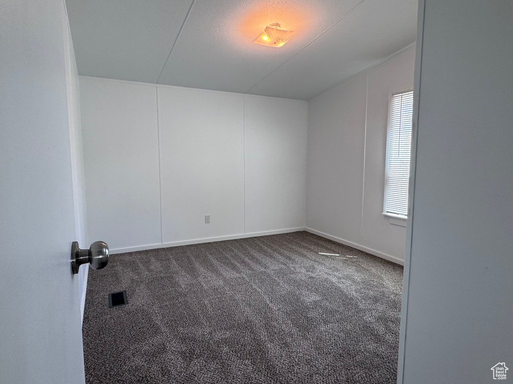 Spare room with carpet flooring and baseboards