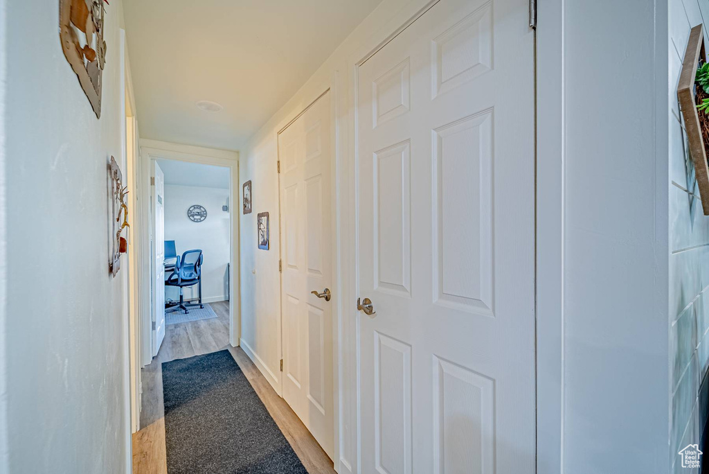 Hallway with wood finished floors