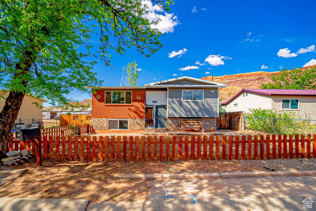 Raised ranch with a fenced front yard