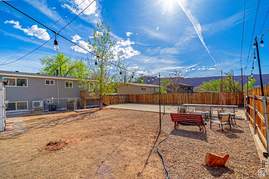 View of yard with a patio area and fence