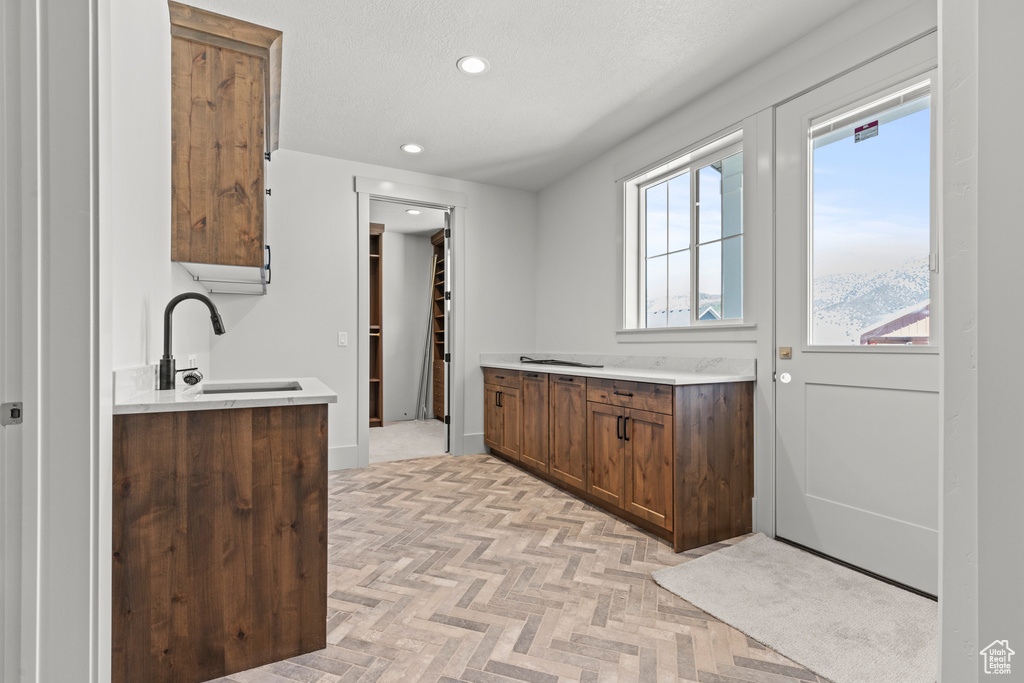 Kitchen featuring recessed lighting and light countertops