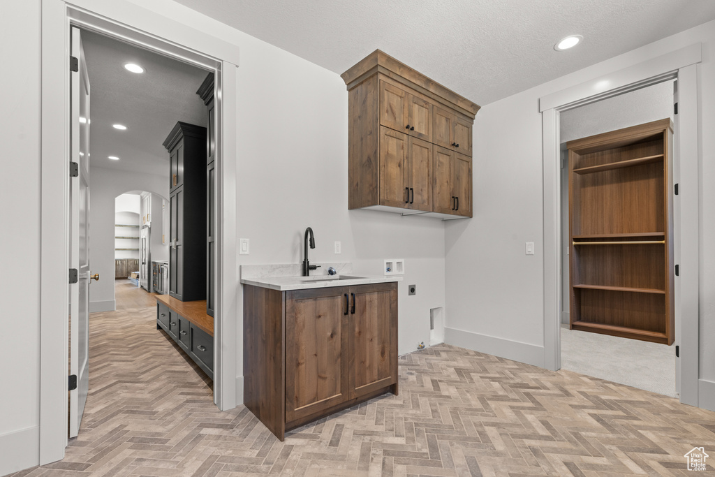 Bar with arched walkways and recessed lighting