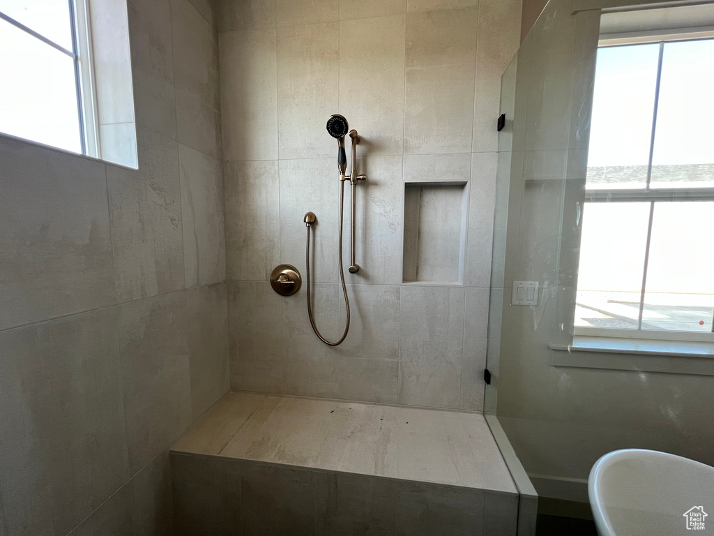 Bathroom with tiled shower