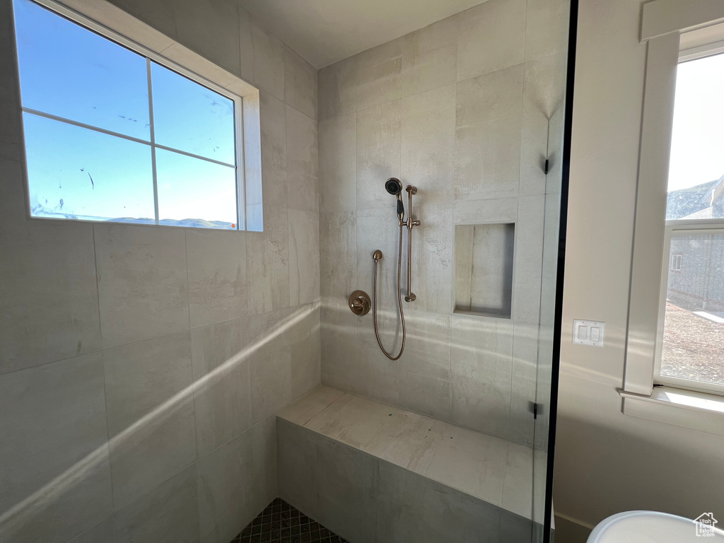 Bathroom featuring a tile shower