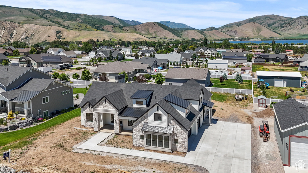 Aerial perspective of suburban area with a mountain backdrop